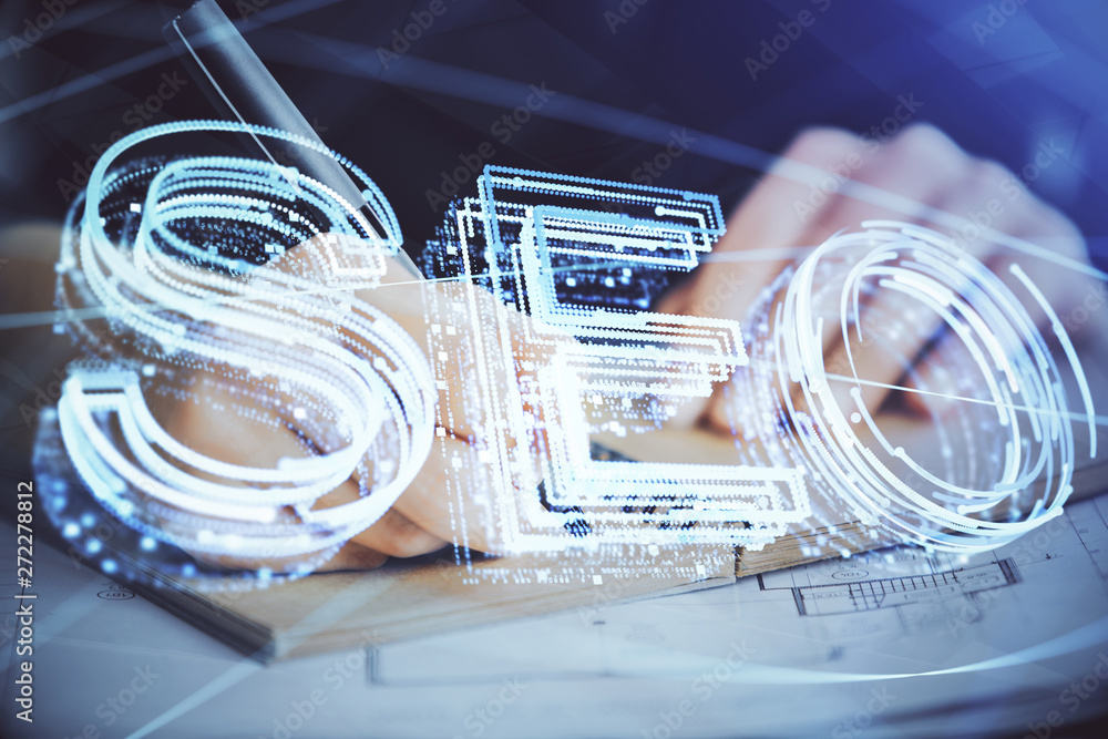Multi exposure of woman's hands making notes with SEO icon. Concept of Search engine optimization Multi exposure of woman's hands making notes with SEO icon. Concept of Search engine optimization