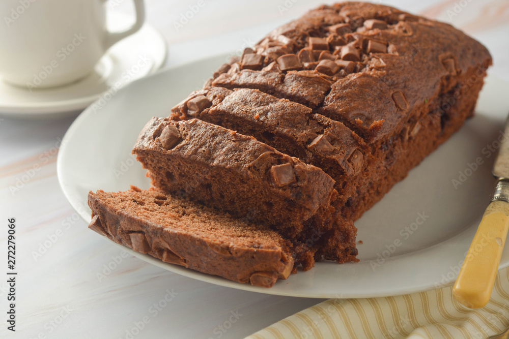Chocolate pound cake. Homemade dark chocolate pastry for breakfast or dessert, bright background. Chocolate pound cake. Homemade dark chocolate pastry for breakfast or dessert, bright background.
