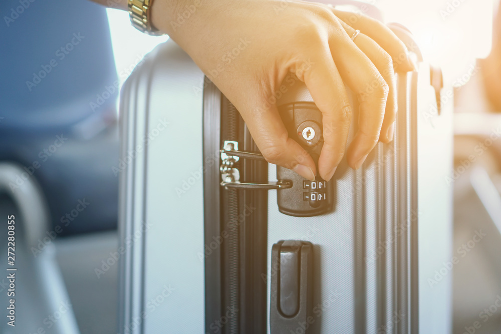 setting codes security padlock with three numbers on luggage Stock