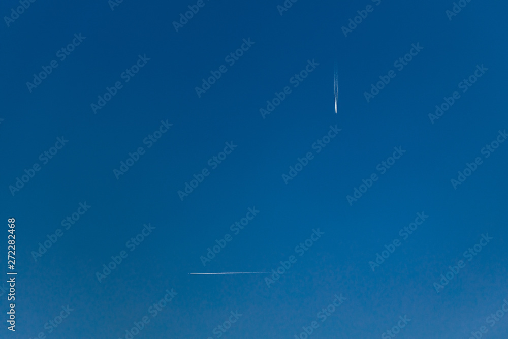 Two aeroplanes vapor trails in the sky Two aeroplanes vapor trails in the sky