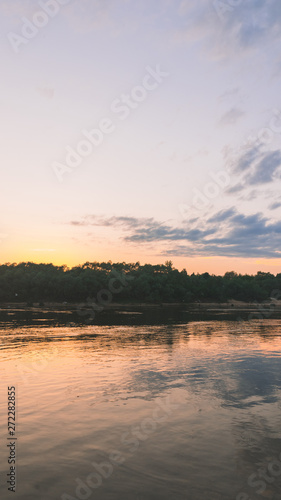 beautiful sunset over the river, flying seagulls