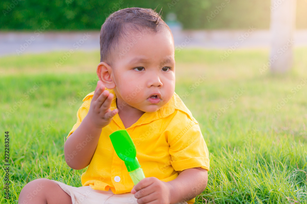 closeup child playing in the park. asian cute baby funny at thailand closeup child playing in the park. asian cute baby funny at thailand