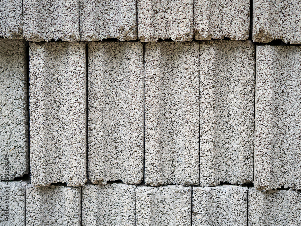 Pattern of grey concrete cement block bricks at construction site. Pattern of grey concrete cement block bricks at construction site.