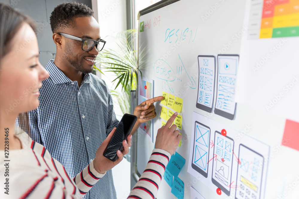 © REDPIXEL - Designers drawing website ux app development.