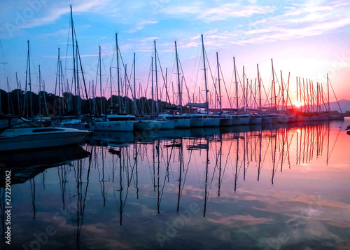 The rose sunrise in sea marina in Croatia with view on the sail boats