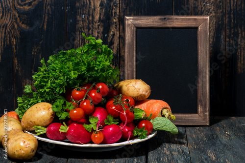 plate with fresh seasonal vegetables and background for text