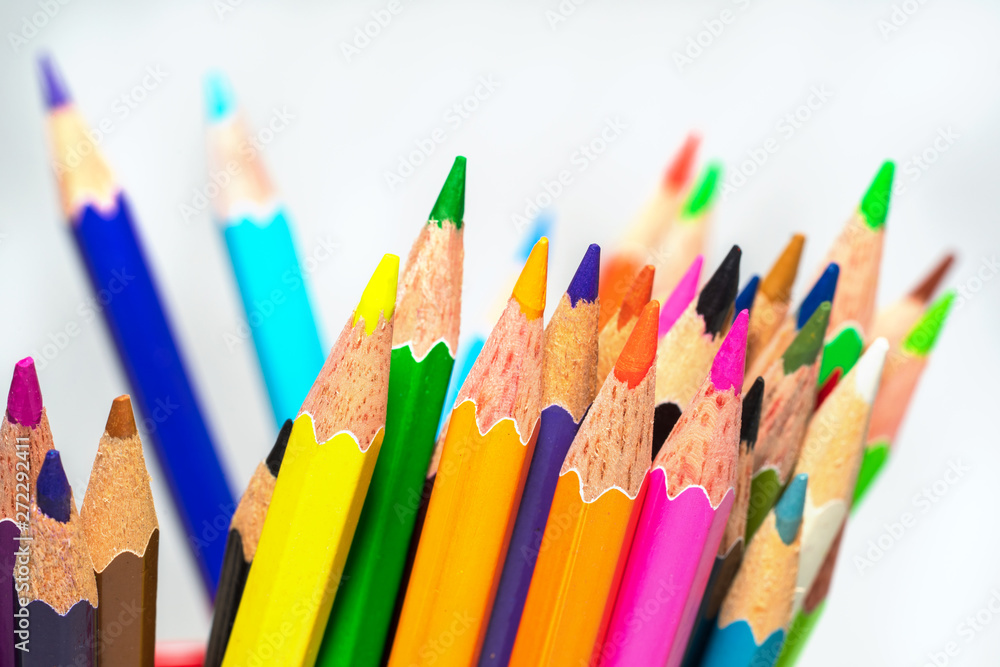 Fototapeta premium Several color pencils on a white background close-up.