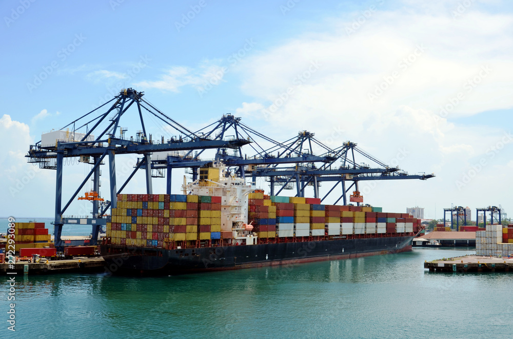 Container ship during cargo operations in the port of Cristobal, Panama. Container ship during cargo operations in the port of Cristobal, Panama.
