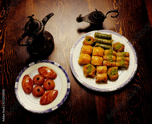 Şekerpare, nightingale nest, lady's belly, baklava, walnut baklava and other sweet varieties are indispensable of the tables. photo