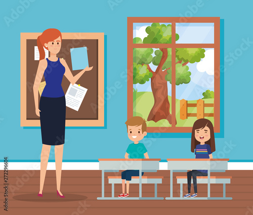 woman teacher in the classroom with kids and desks