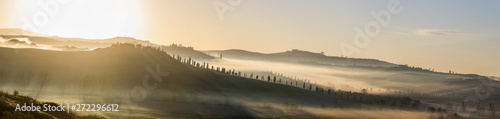 sunrise over a fields and hills in Tuscany