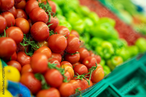 Fototapeta Naklejka Na Ścianę i Meble -  Fresh tomato and peppers in grocery markets full of vegetables
