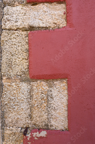Red wall with stone bricks