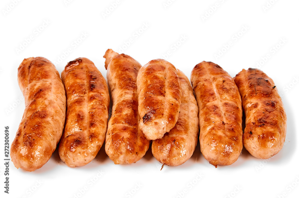Meat sausages with glitter on a light background. Fried sausage. The concept of traditional cuisine.