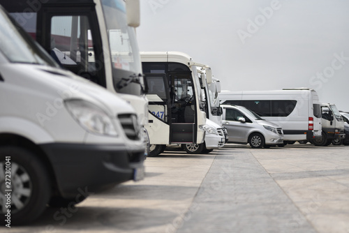 buses and minibuses shuttles taxi parked in row © Oleksandr