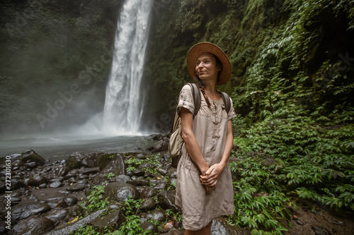 Woman near Nung Nung waterfal on Bali  Indonesia