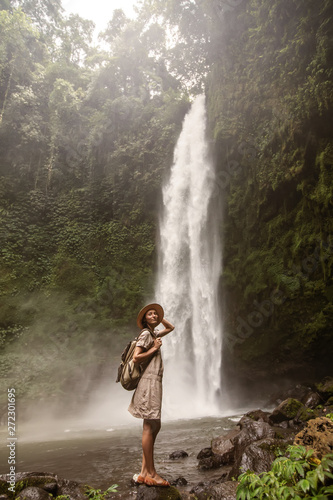 Woman near Nung Nung waterfal on Bali  Indonesia