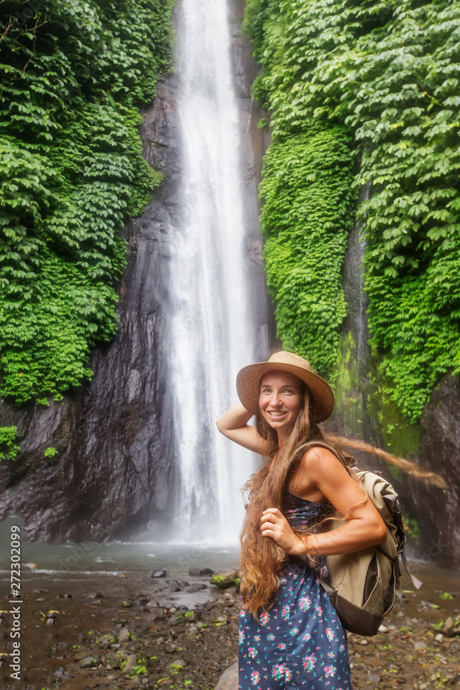 Woman near Munduk waterfal on Bali, Indonesia Woman near Munduk waterfal on Bali, Indonesia