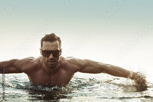 Samolepka Portrait of a serious man in a tropical pool