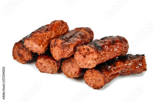 Meat sausages with glitter on a light background. Fried sausage. The concept of traditional cuisine.
