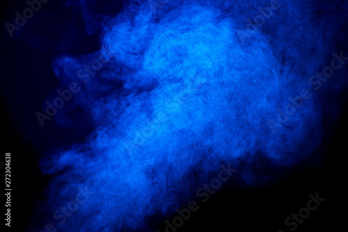 Bright blue smoke isolated on black background