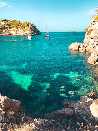 Lovely turquoise water beaches and coastline view on a summer vacation day with colorful sunset mood. Cala Portals Vells, Mallorca, Spain, Balearic Islands