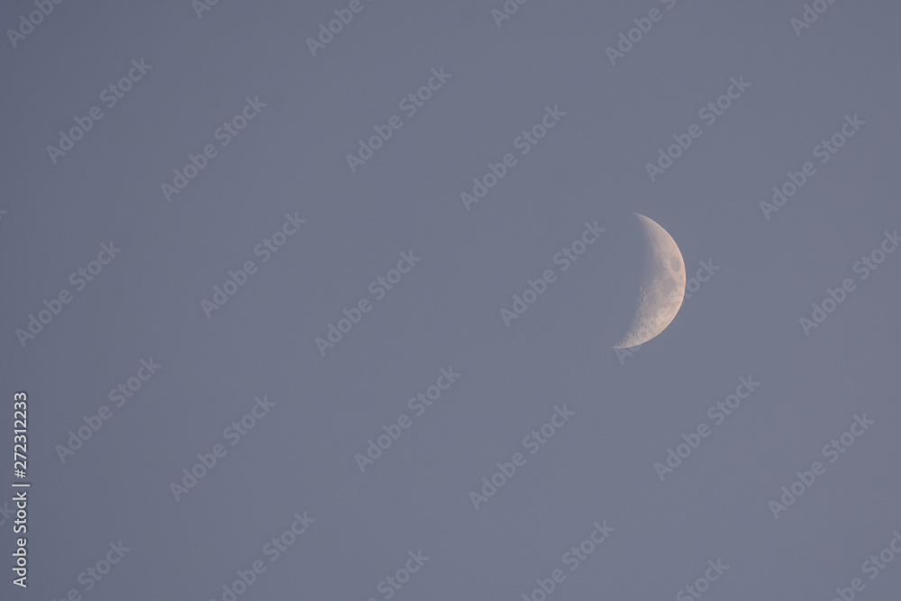 Crescent moon in the evening sky. Concept - an evening of memories Crescent moon in the evening sky. Concept - an evening of memories