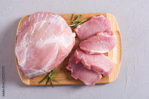 Raw pork meat on wooden background