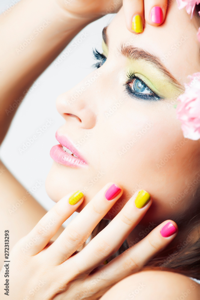 young pretty brunette woman with pink flowers and manicure posing cheerful isolated on white background closeup young pretty brunette woman with pink flowers and manicure posing cheerful isolated on white background closeup