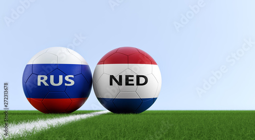 Russia vs. Nertherlands Soccer Match - Soccer balls in Russia and Netherlands national colors on a soccer field. Copy space on the right side - 3D Rendering 
