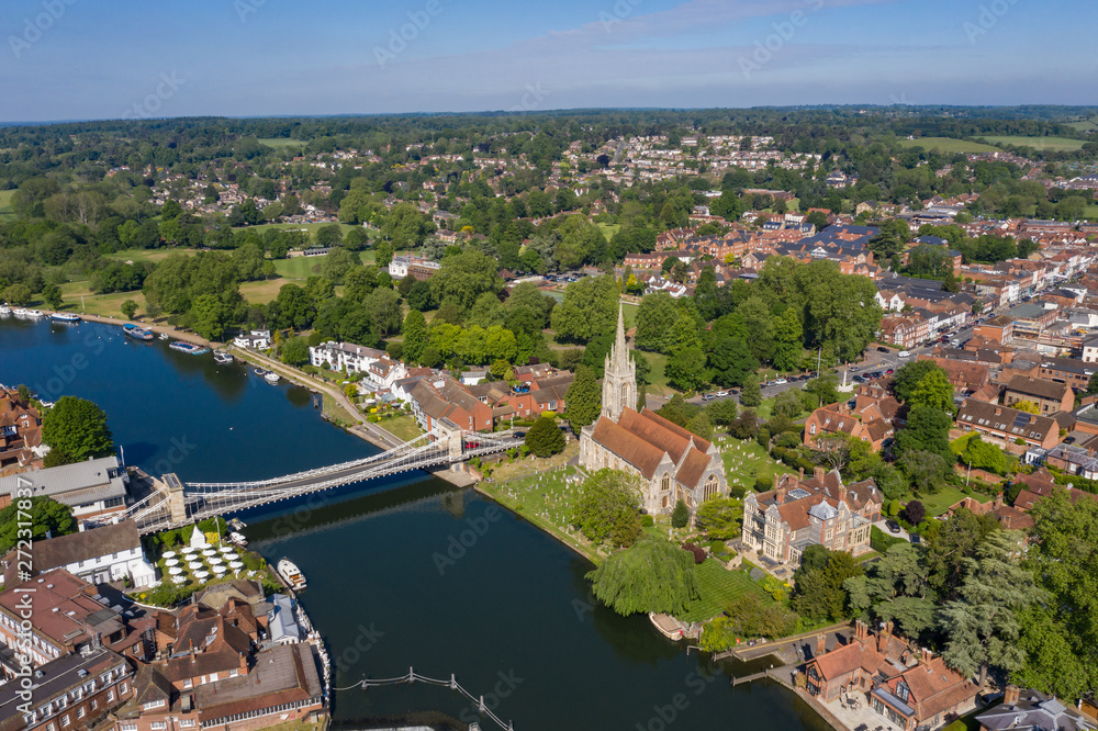 All Saints church and the Marlow suspension bridge over the river Thames in Marlow, Buckinghamshire, UK
