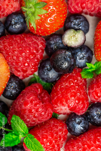 Fresh summer berries such as blueberries  strawberries  raspberries  top view