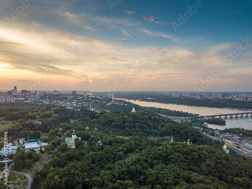 Panoramic view of Kyiv from the sky. Sunset over summer Kiev. Filmed on drone. Aerial view © Vadym Sarakhan
