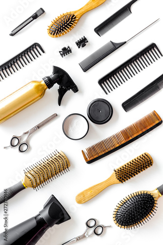 Set of professional hairdresser tools with combs and styling on white background top view pattern