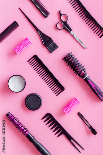 Set of professional hairdresser tools with combs, sciccors and styling on pink background top view pattern