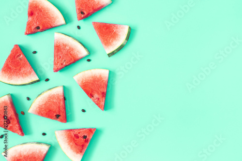 Watermelon pattern. Red watermelon on mint background. Summer concept. Flat lay, top view, copy space