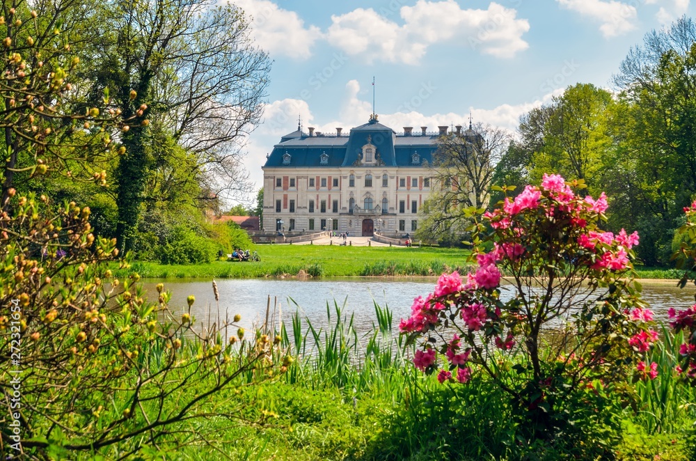 Beautiful historic castle in colorful spring scenery. Neo baroque castle in a park in Pszczyna in Poland.