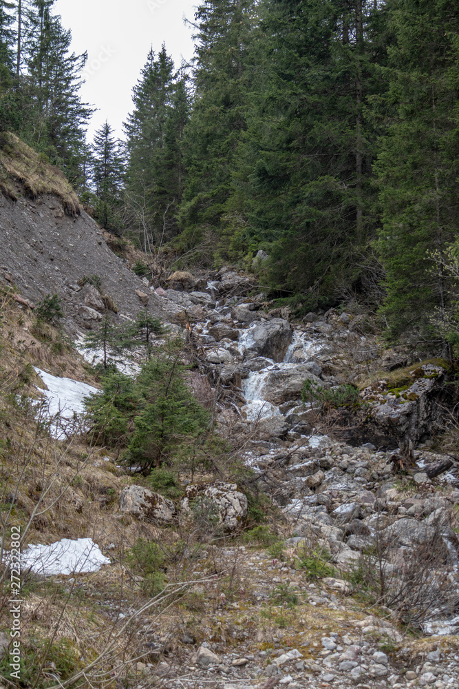 Panorama of untouched landscapes in the Austrian Alps with river, streams and waterfalls