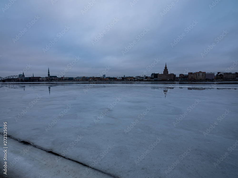 pieces of frozen ice in the lake in dim winter day