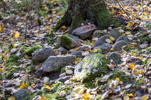 large rock in sand in countryside