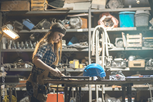 young woman working in a workshop