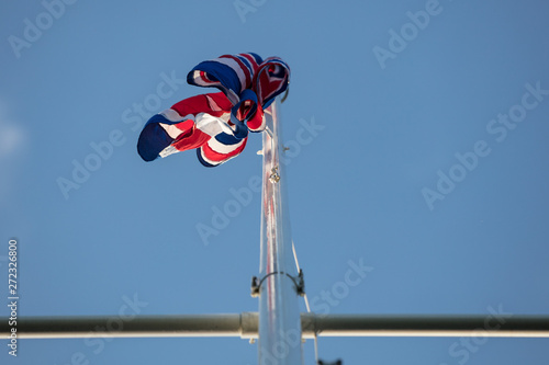 Union Jack flag atop a nautical flagpole in the high street in Marlow Buckinghamshire, UK photo