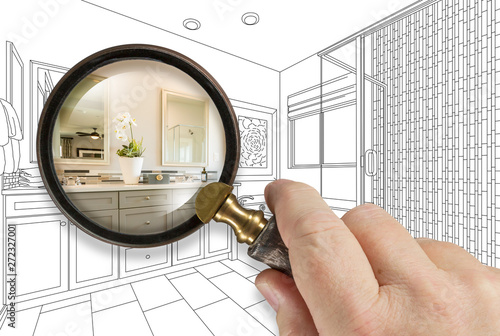 Hand Holding Magnifying Glass Revealing Custom Bathroom Design Drawing and Photo Combination