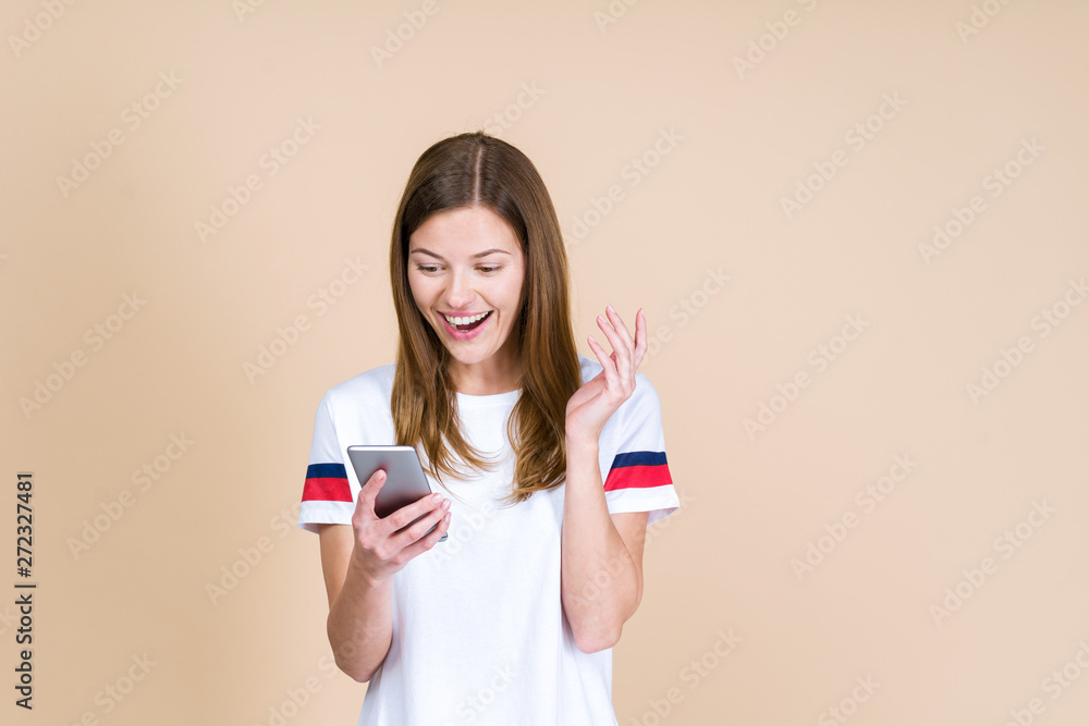 Front view of adult girl holding smartphone in hands Front view of adult girl holding smartphone in hands