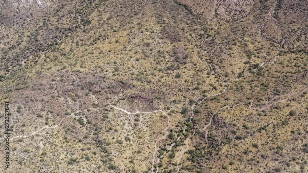 Expansive view of desert mountain hiking biking trails above snaking themselves in every direction. Aerial footage - Superstition Mountain, Arizona. Expansive view of desert mountain hiking biking trails above snaking themselves in every direction. Aerial footage - Superstition Mountain, Arizona.