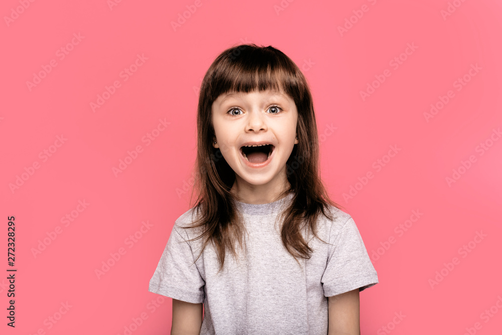 Wow. Crazy good news. Image of overjoyed excited screaming amazed little child girl standing isolated over pink background. Looking camera with open mouth. Wow. Crazy good news. Image of overjoyed excited screaming amazed little child girl standing isolated over pink background. Looking camera with open mouth.