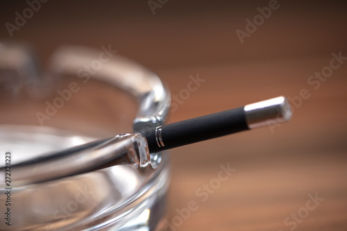 Glass Ashtray and cigarette closeup