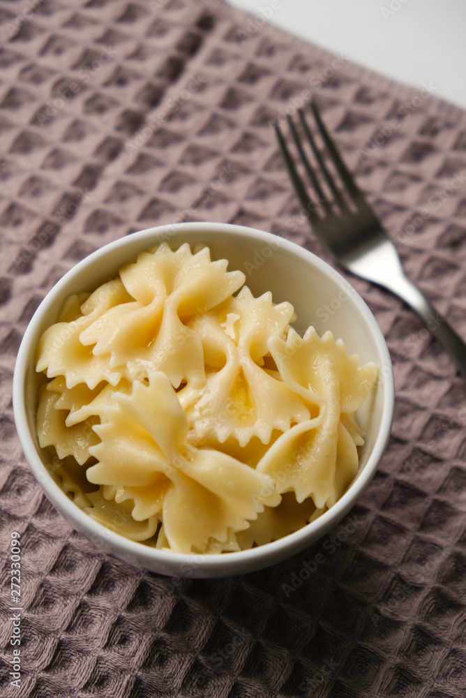 Cooked pasta with butter in a plate Cooked pasta with butter in a plate