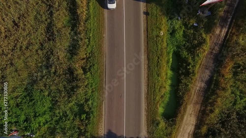 View of car driving on country road in forest drone forest road car nature flight fly helicopter rural shot top transport travel tree automobile country drive landscape trip slow motion