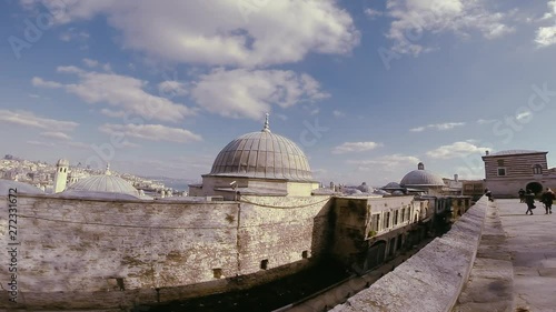 Happy tourist woman take pictures and enjoy panoramic view at observation deck of Topkapi Palace. Beautiful scenery of Bosphorus Strait waters, Uskudar shore and Marmara Sea opening from terrace